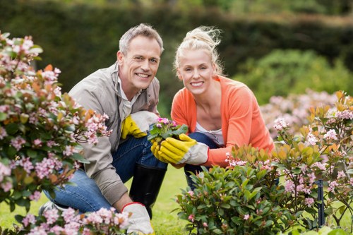 Gardener planting flowers in Dolls Point